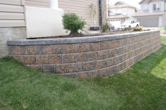 Rustic Pisa 2 with Charcoal capstone block retainer wall